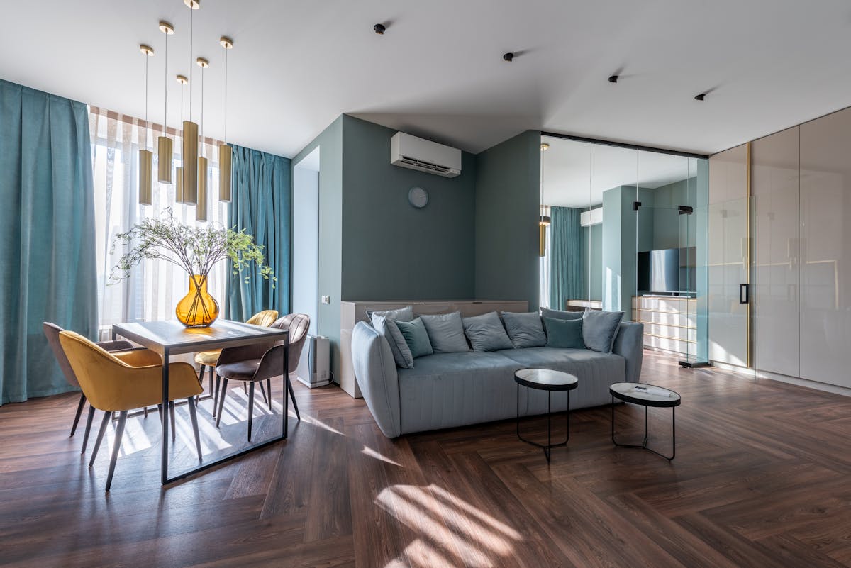 Furniture pushed against every wall with empty center