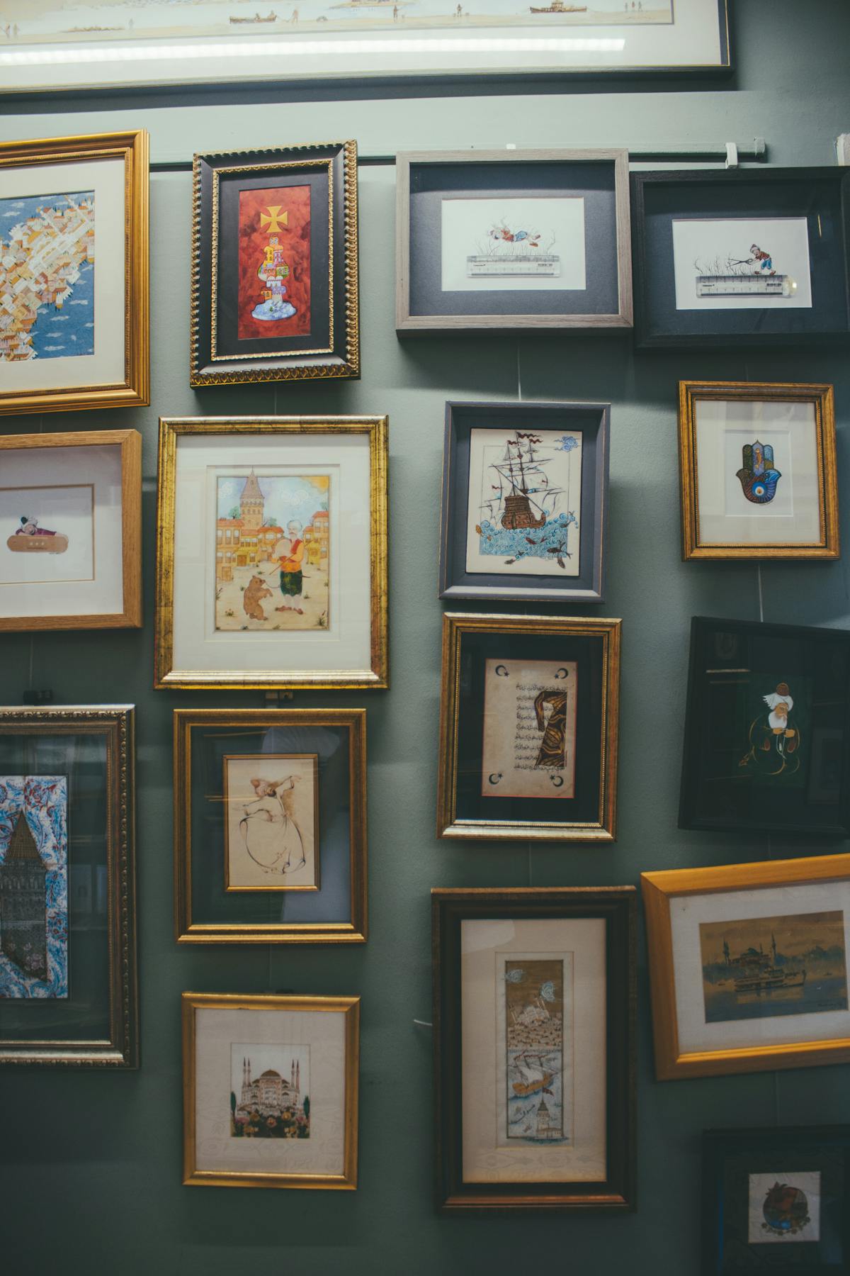 Mass-produced framed prints and cheap art on wall