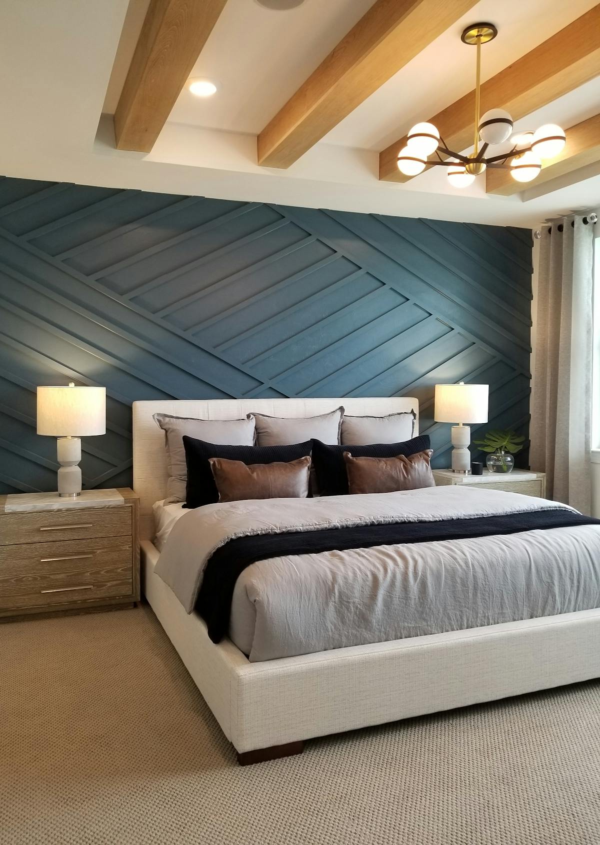 Bold blue accent wall in bedroom